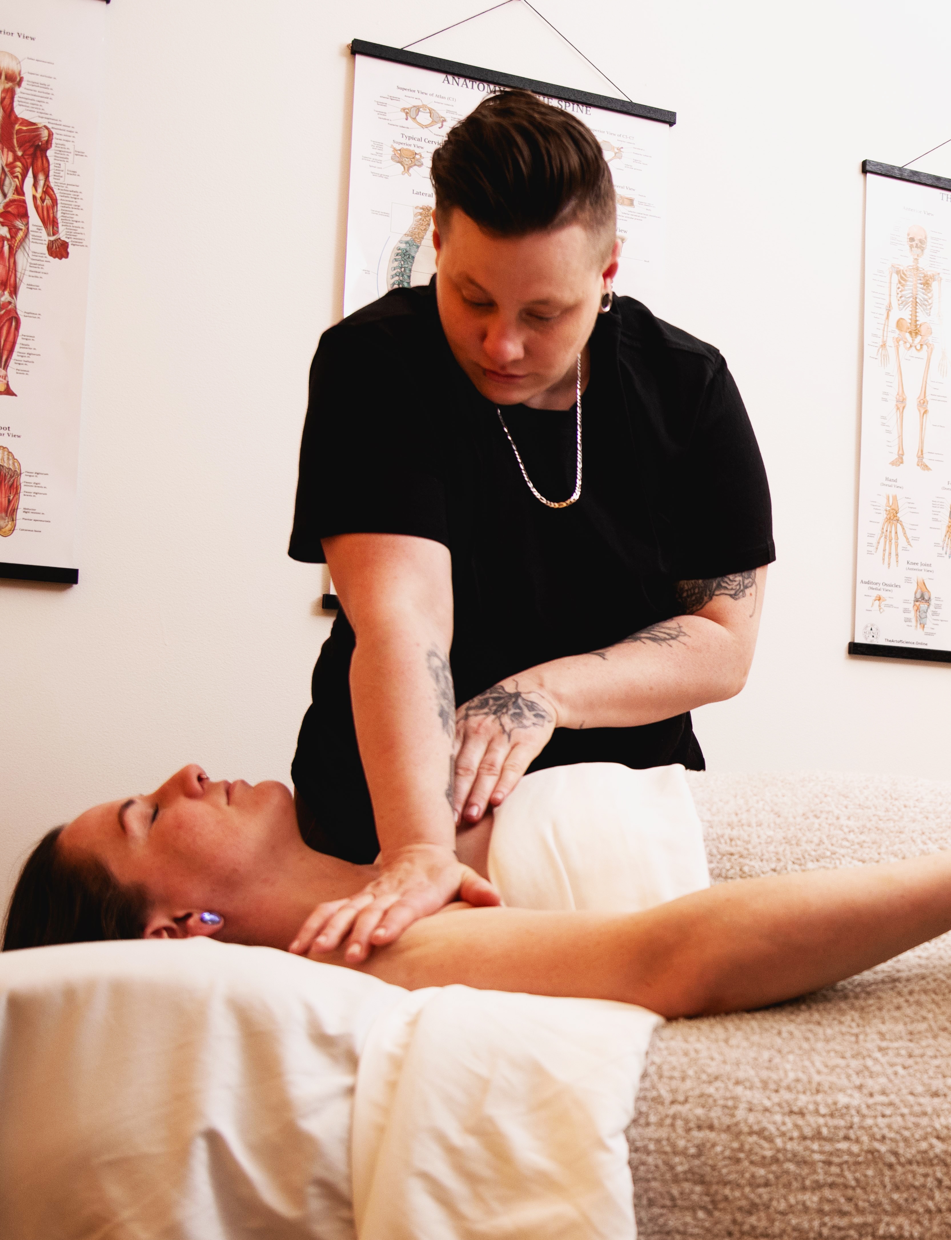 Massage therapist performing treatment with anatomical knowledge