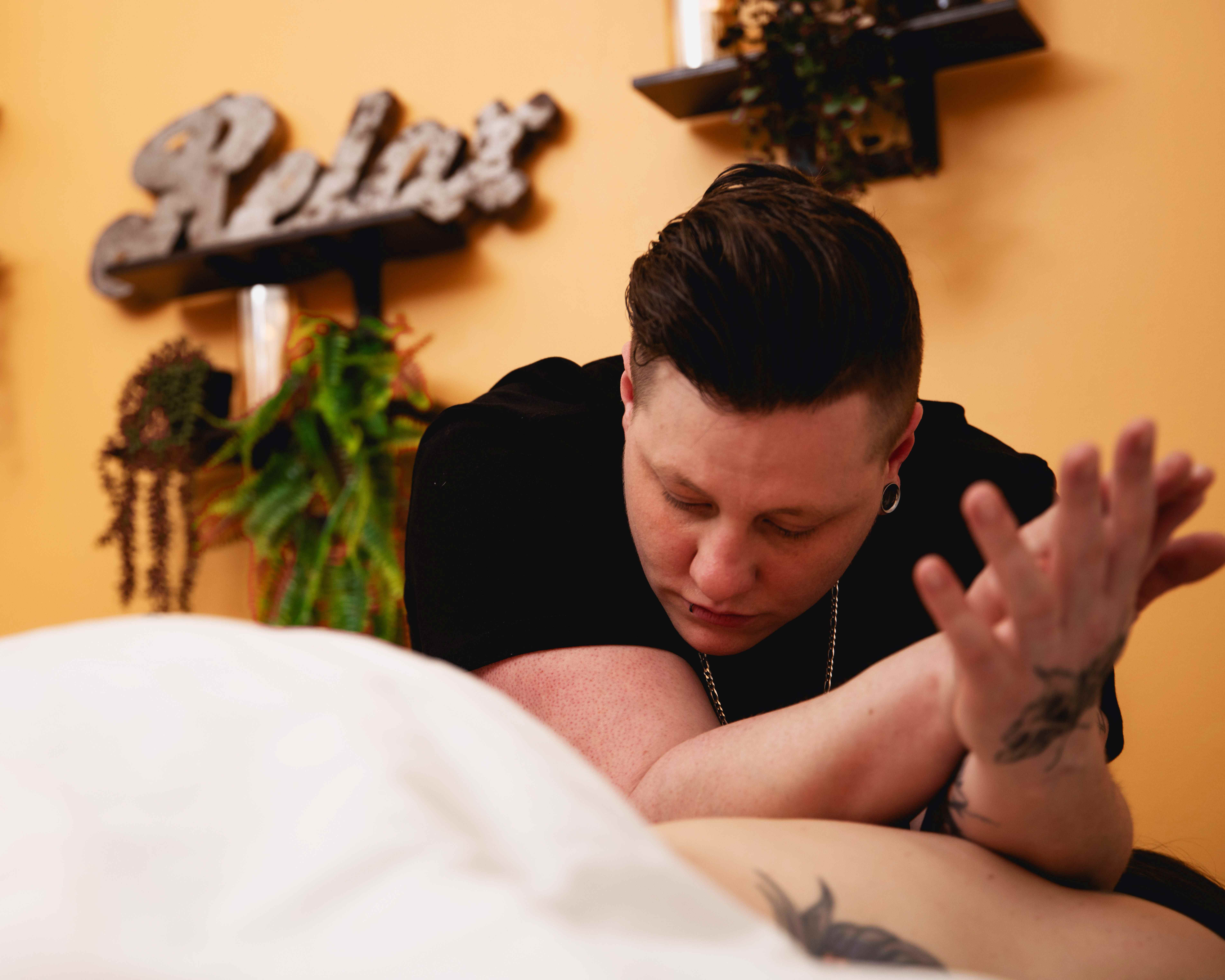 Danielle performing deep tissue massage therapy