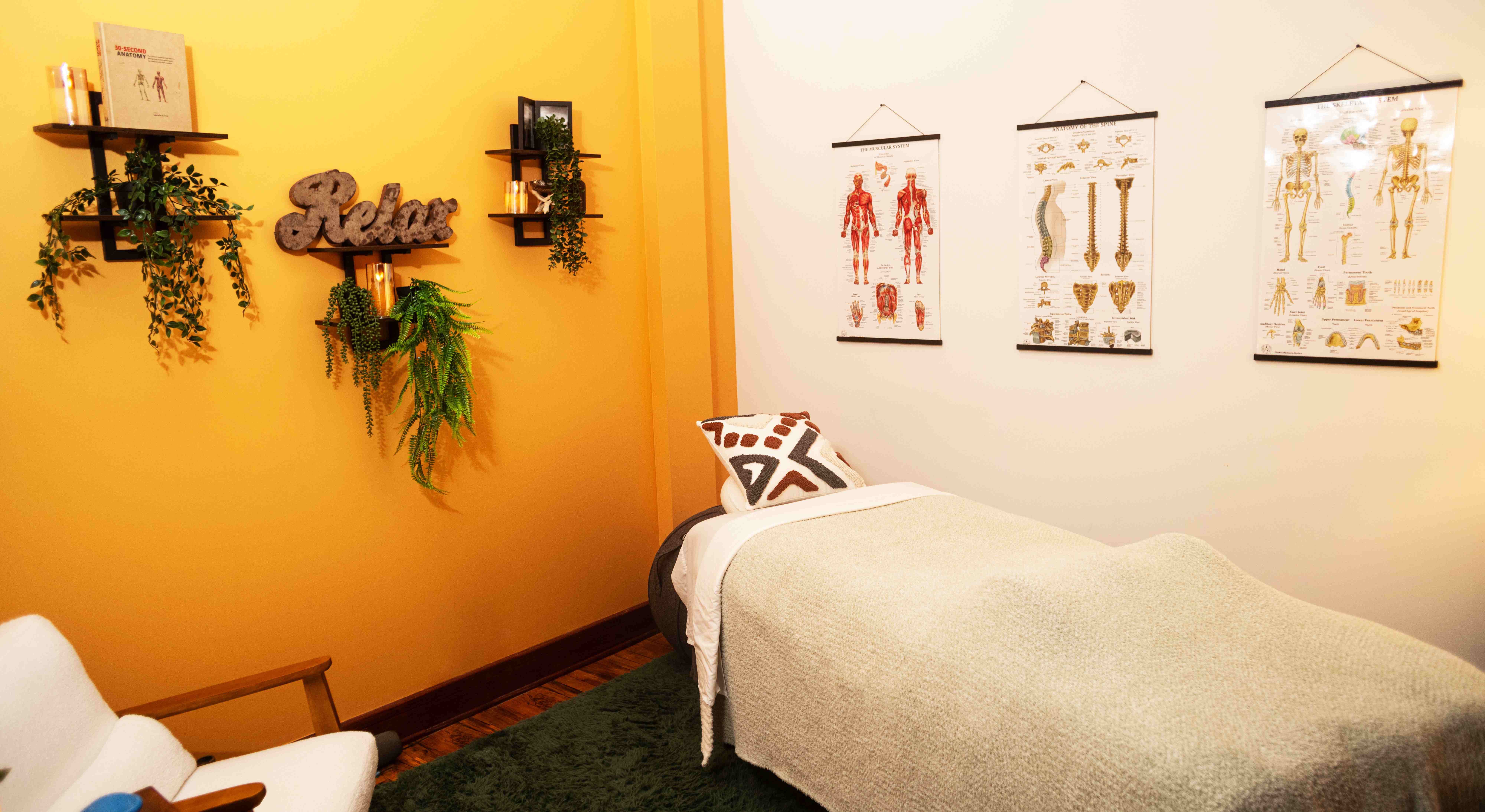 Massage therapy room with yellow walls